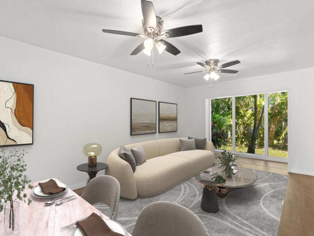 This is a digital rendering of a living and dining area with a curved sofa — 1166 6th Avenue # C5, Vero Beach FL 32960, VERO BEACH, FL