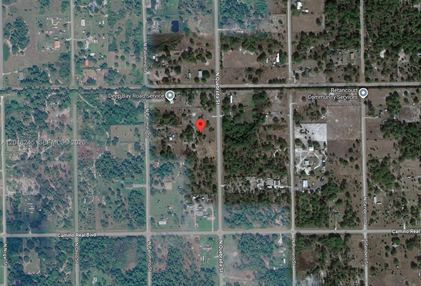 This is a satellite map view of a vacant lot marked with a red pin — 360 N Quebrada St, Clewiston FL 33440, CLEWISTON, FL