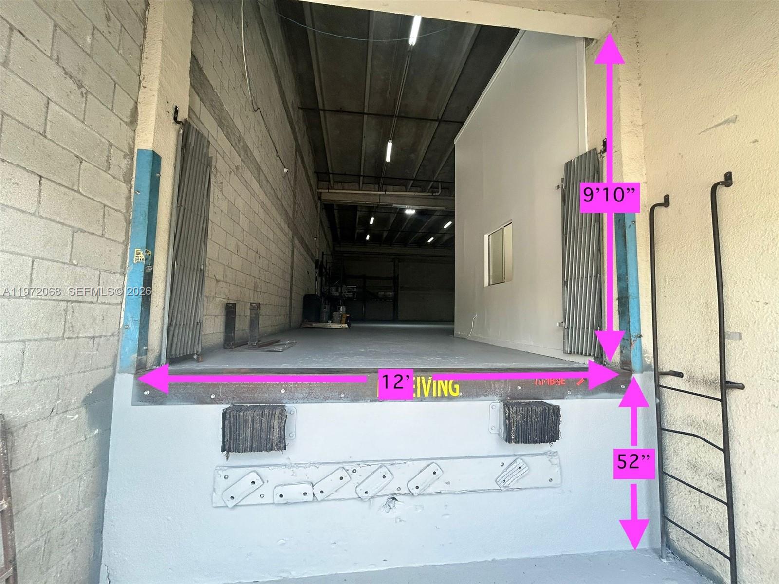 A loading dock bay features a concrete platform with metal bumpers and a high opening — 6910 NW 50th St # 1, Miami FL 33195, MIAMI, FL