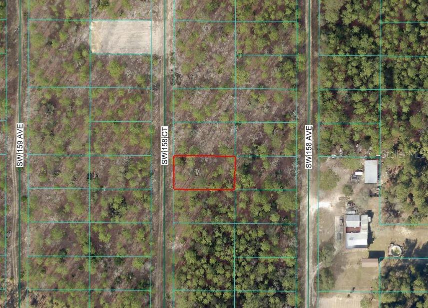 This aerial map shows a rectangular vacant lot outlined in red between two dirt roads — SW 158 COURT, OCALA, FL