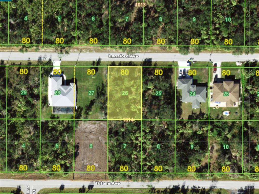 An aerial map view shows a highlighted vacant residential lot situated between two existing houses — 18407 LANSFORD AVENUE, PORT CHARLOTTE, FL