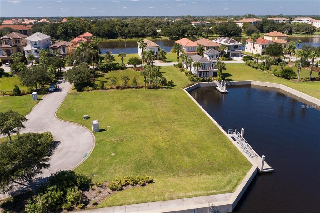 An aerial view of a vacant waterfront residential lot with a private boat dock — 12 CUTTER COURT, PALM COAST, FL
