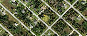 This aerial map view shows a vacant, rectangular residential lot surrounded by trees and houses — 11322 5TH AVENUE, PUNTA GORDA, FL