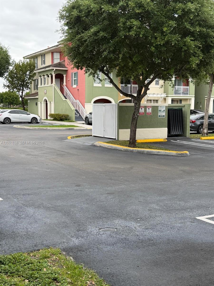 An outdoor basketball court features a blue and green surface with two hoops — 11102 NW 83rd St # 217, Doral FL 33178, DORAL, FL