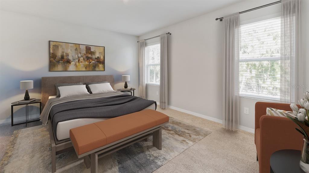 A bedroom features a bed with a bench, two side tables, and an orange armchair — 16435 BECASSE DRIVE, PUNTA GORDA, FL