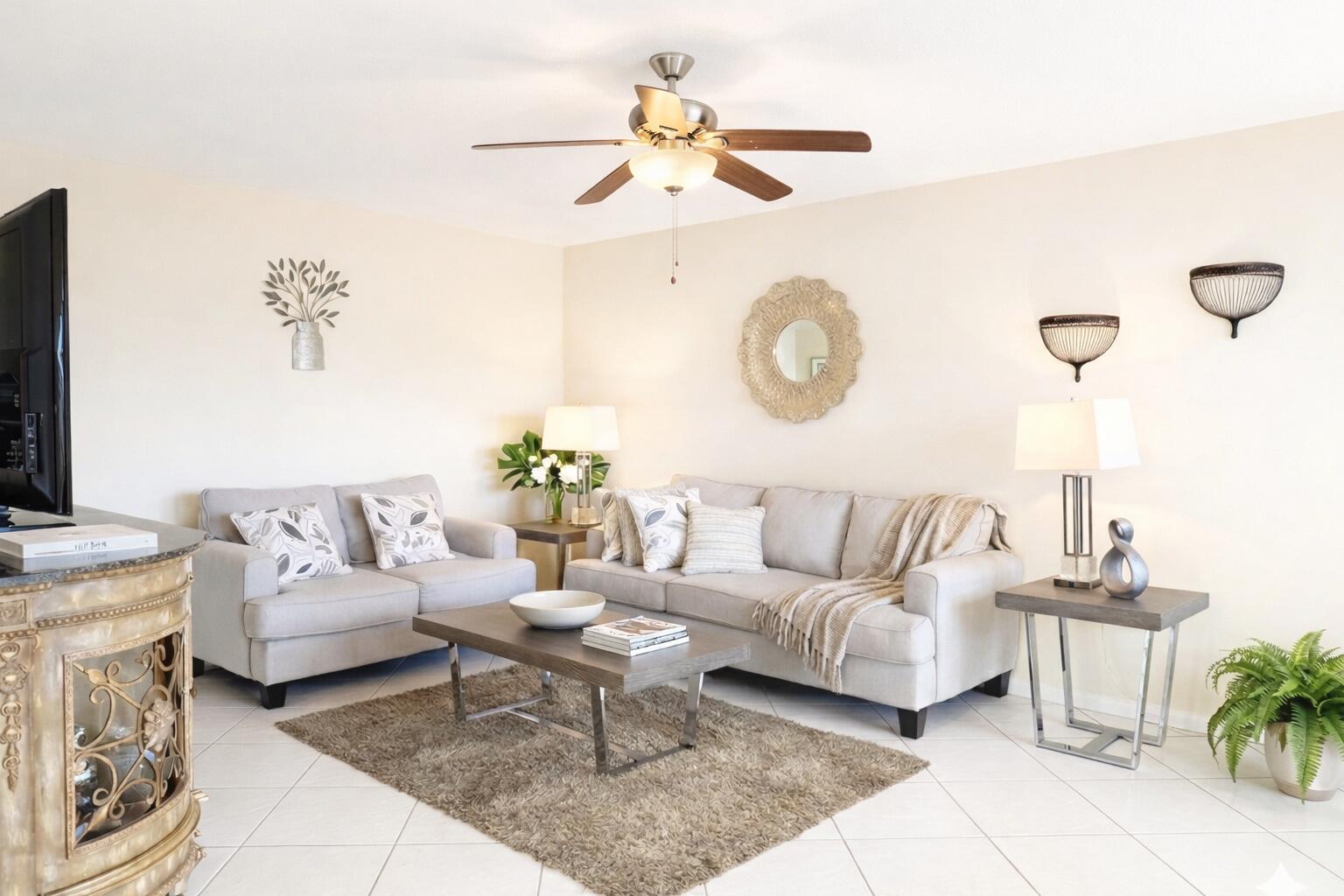 A living room features two light gray sofas, a coffee table, and a ceiling fan — 33 Preston A, Boca Raton FL 33434, BOCA RATON, FL