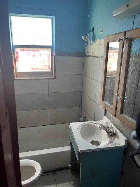 A bathroom features a bathtub, a pedestal sink, a toilet, and blue walls with tile — 2956 NW 49th Street, Miami FL 33142, MIAMI, FL
