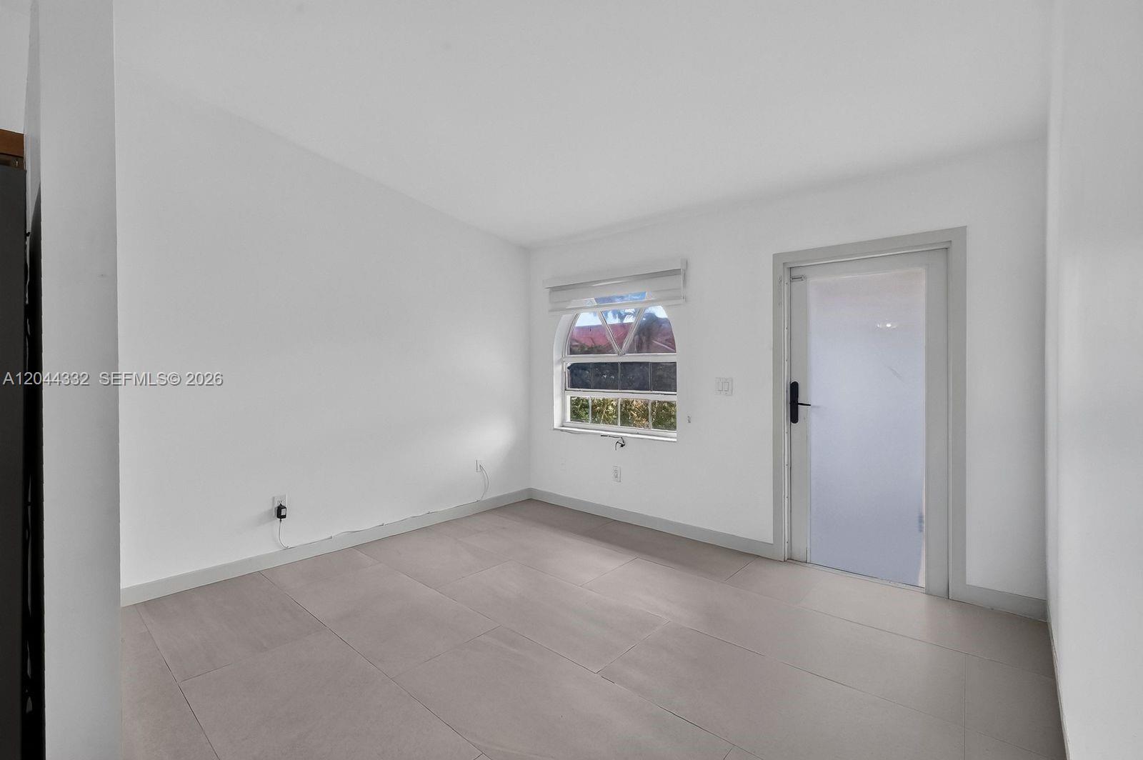A single-story house with a red driveway, a tiled roof, and arched windows — 2141 W 53rd St # 1, Hialeah FL 33016, HIALEAH, FL