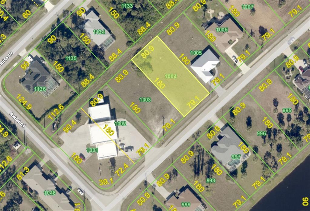 This is an aerial map showing property lot lines and parcel numbers for a neighborhood — 407 BOUNDARY BOULEVARD, ROTONDA WEST, FL