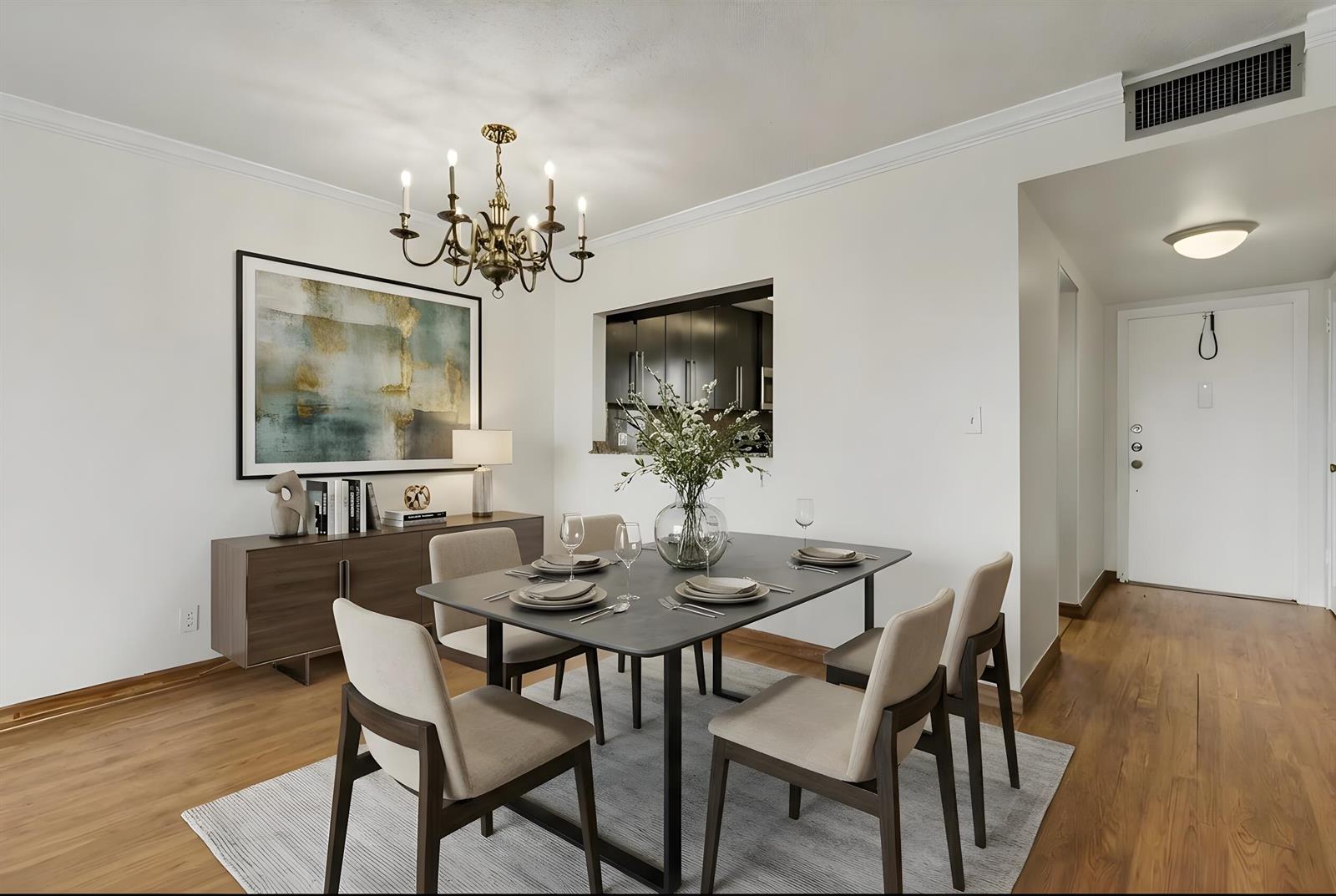 A dining room features a dark table, six chairs, a chandelier, and a wooden sideboard — 950 Hillcrest Drive # 514, Hollywood FL 33021, HOLLYWOOD, FL