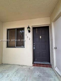 The exterior view shows a brown front door with the number 102 and a window — 6552 Arleigh Ct # 102, Boca Raton FL 33433, BOCA RATON, FL