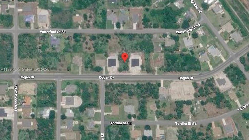 This aerial map shows two adjacent rectangular structures located between Cogan Drive and Waterford Street — 2065 SE Cogan Dr, Palm Bay FL 32909, PALM BAY, FL