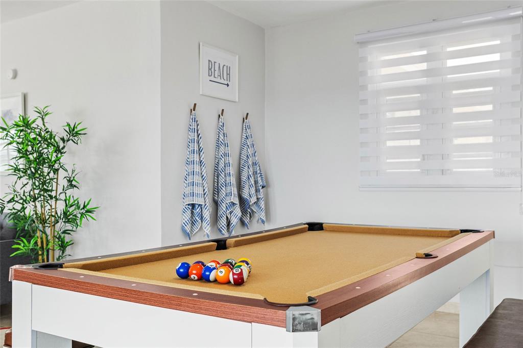A game room features a pool table with a tan felt surface and white frame — 14-2 CAMINO LAS PICUAS, RIO GRANDE, PR