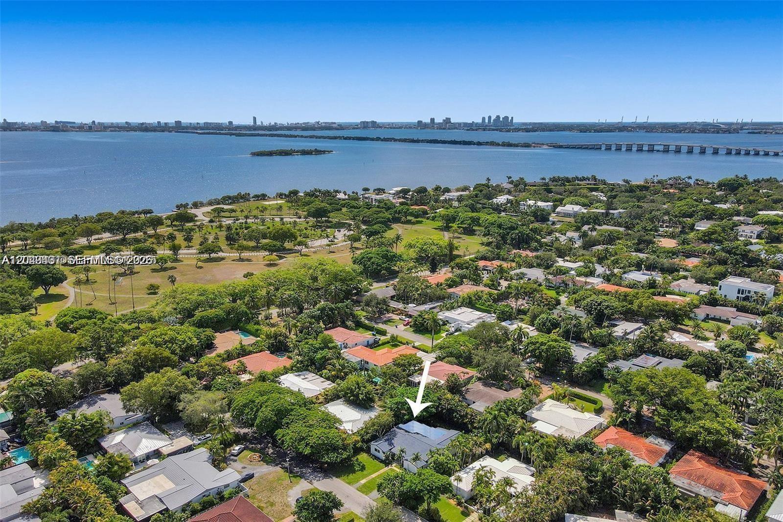 An aerial view shows a residential neighborhood with a house marked by a white arrow — 630 NE 52nd Ter, Miami FL 33137, MIAMI, FL