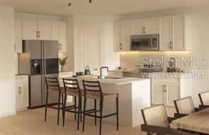 This is a rendering of a modern kitchen featuring white cabinetry, stainless steel appliances, and an island — 86 SPRINGWOOD DRIVE, PALM COAST, FL