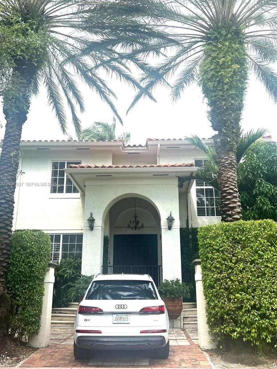 A white Audi Q7 is parked in front of a two-story house with palm trees — 797 Glenridge Rd, Key Biscayne FL 33149, KEY BISCAYNE, FL