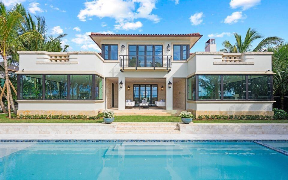 A two-story stucco house with a swimming pool, large windows, and a second-floor balcony — 1260 N Lake Way, Palm Beach FL 33480, PALM BEACH, FL
