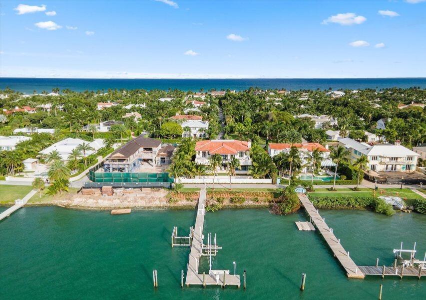 An aerial view shows waterfront homes with private docks along a canal near the ocean — 1260 N Lake Way, Palm Beach FL 33480, PALM BEACH, FL