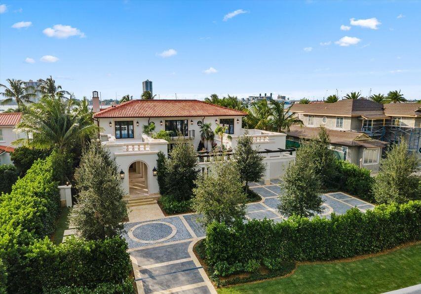 An aerial view shows a Mediterranean-style house with a red tile roof and paved driveway — 1260 N Lake Way, Palm Beach FL 33480, PALM BEACH, FL