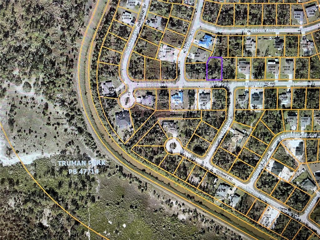 This is an aerial map showing a vacant residential lot highlighted in purple within a neighborhood — LOT 18 EXOTIC AVENUE, NORTH PORT, FL
