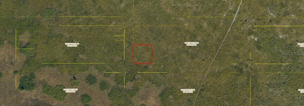 An aerial map view shows a red-outlined rectangular plot of land in a rural area — PALMETTO AVENUE, KENANSVILLE, FL