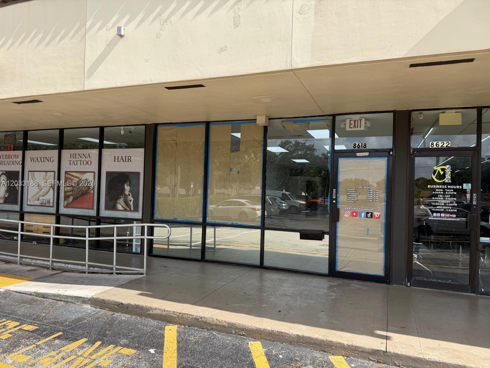 The exterior of a commercial storefront features large glass windows and a glass entrance door — 8618 NW 44th st, Sunrise FL 33351, SUNRISE, FL