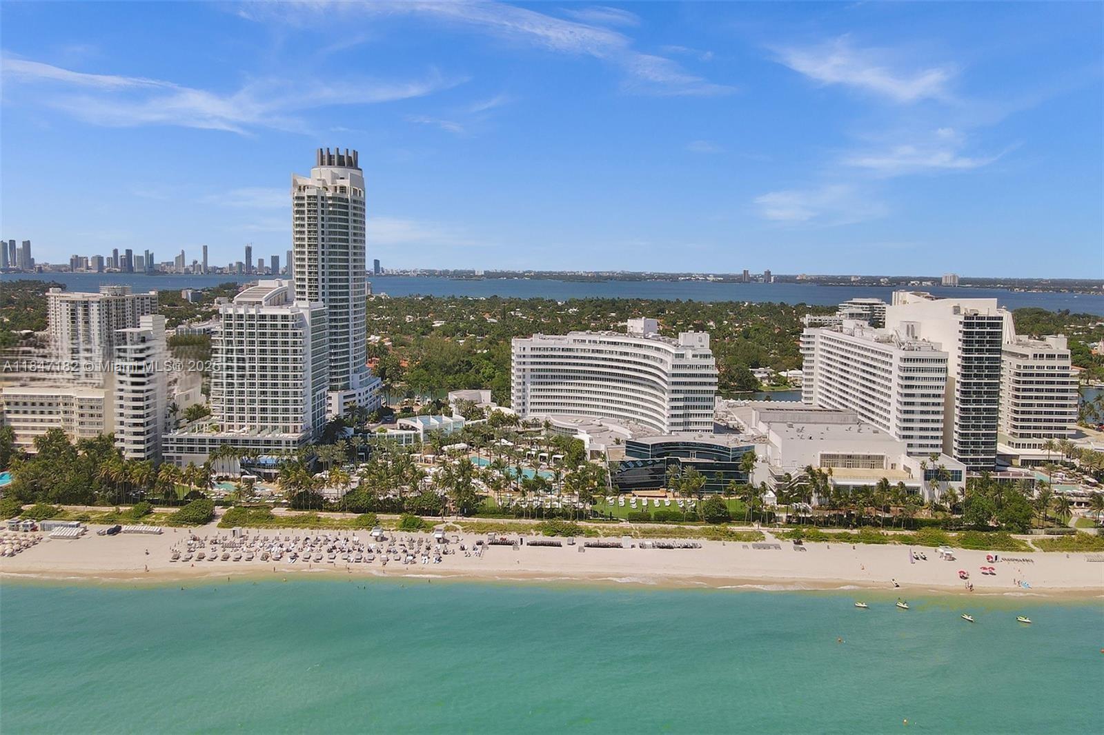 An aerial view of a beachfront resort with multiple high-rise buildings and a sandy beach — 4401 Collins Ave, Miami Beach FL 33140, MIAMI BEACH, FL