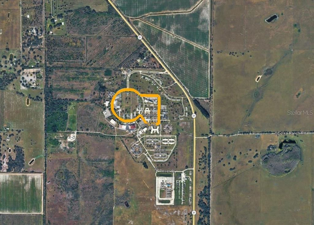 This is an aerial map view of a property complex with highlighted buildings — 0000 SE HWY 31, ARCADIA, FL