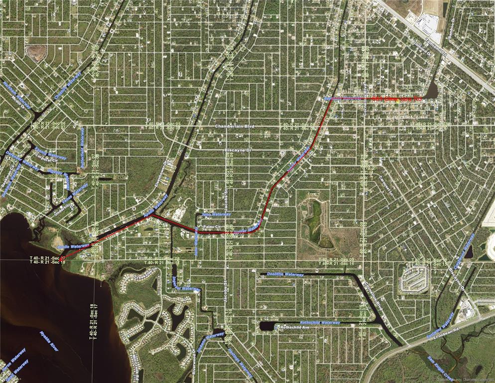 This is a map showing a section of a residential area with highlighted waterways — 661 CLEARVIEW DRIVE, PORT CHARLOTTE, FL