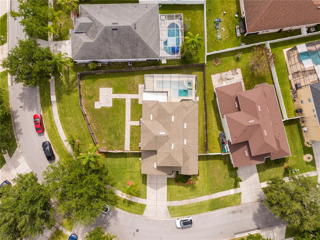 Aerial view of a suburban neighborhood featuring houses with swimming pools and fenced backyards — 1986 MARSH HAWK DRIVE, ORLANDO, FL