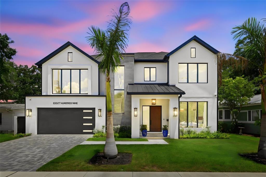 A modern two-story house with white stucco, a dark garage, and a palm tree — 809 E CHURCH STREET, ORLANDO, FL