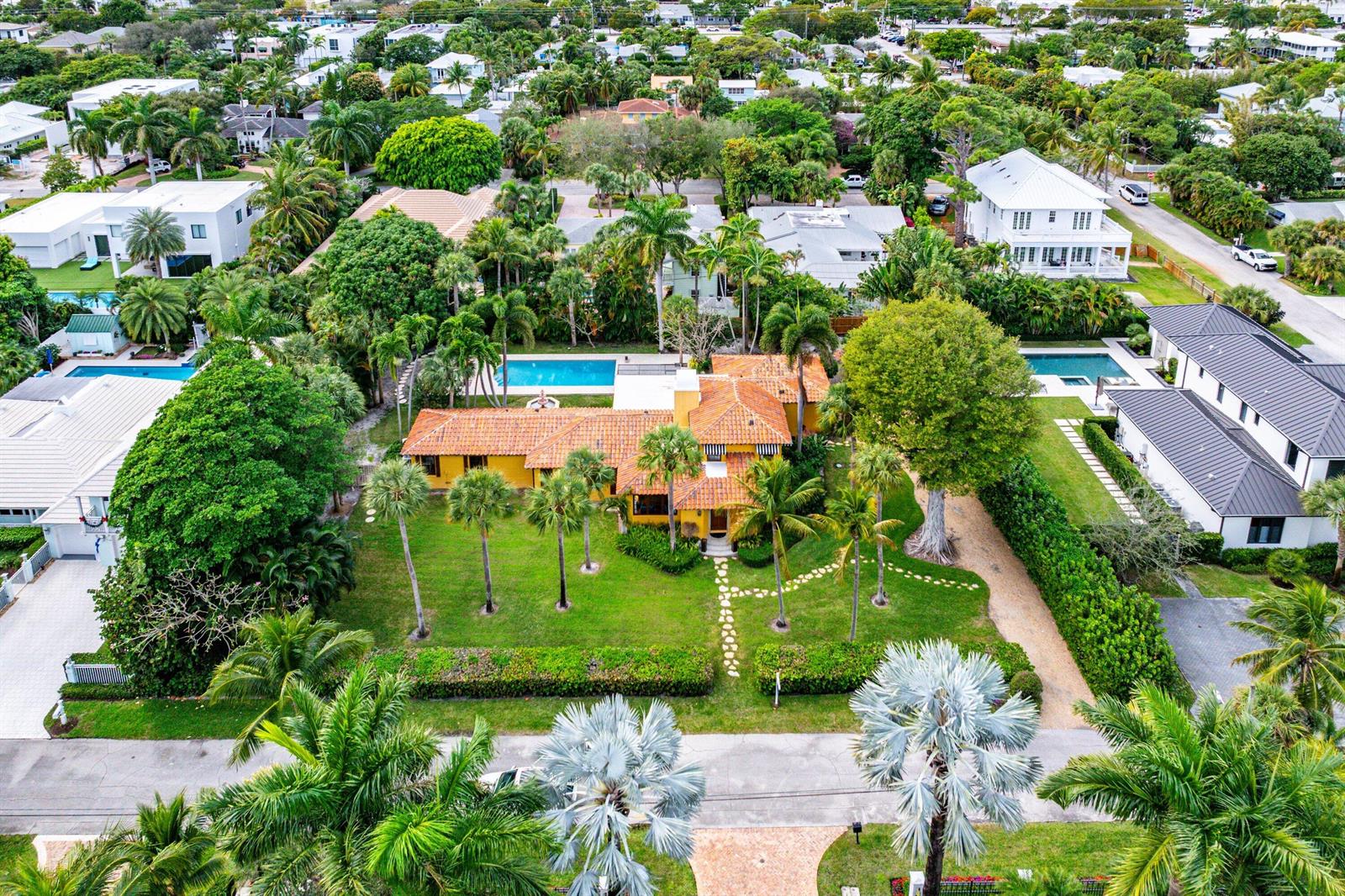 An aerial view shows a yellow house with a terracotta roof and a swimming pool — 334 Palm Trail, Delray Beach FL 33483, DELRAY BEACH, FL