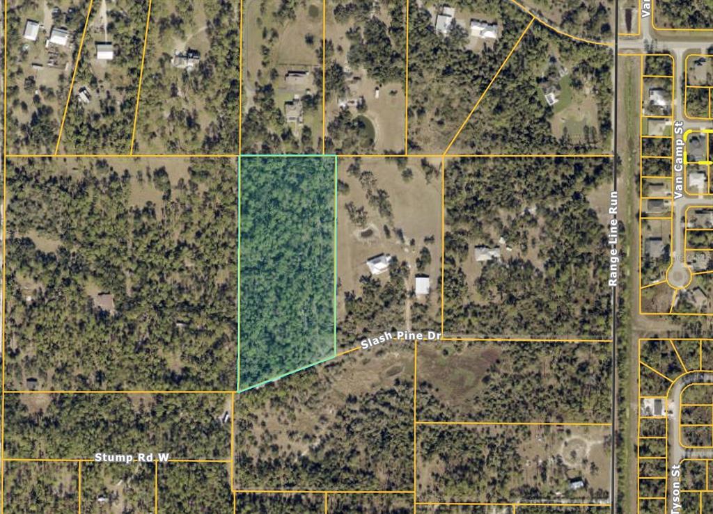 An aerial map view shows a rectangular, wooded parcel of land highlighted in green — SLASH PINE DRIVE, NORTH PORT, FL