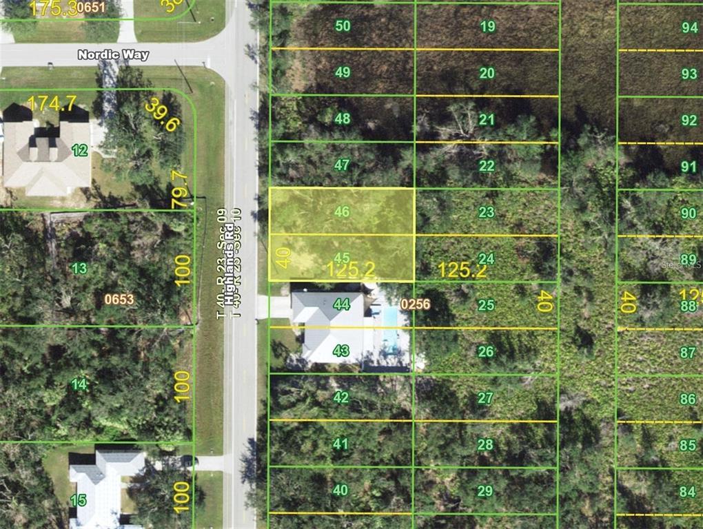 This is a map showing a residential lot highlighted in yellow among surrounding properties — 1094 HIGHLANDS ROAD, PUNTA GORDA, FL
