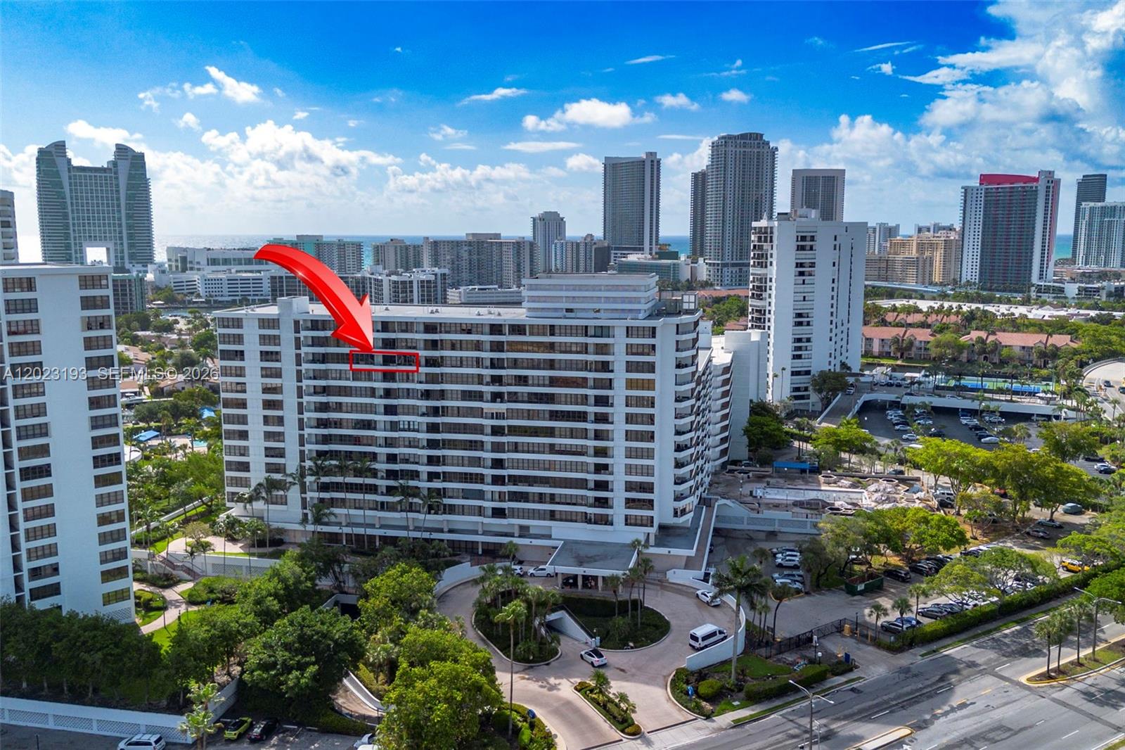 An aerial view of a multi-story residential building with a red arrow pointing to a balcony — 500 Three Islands Blvd # 1008, Hallandale Beach FL 33009, HALLANDALE BEACH, FL