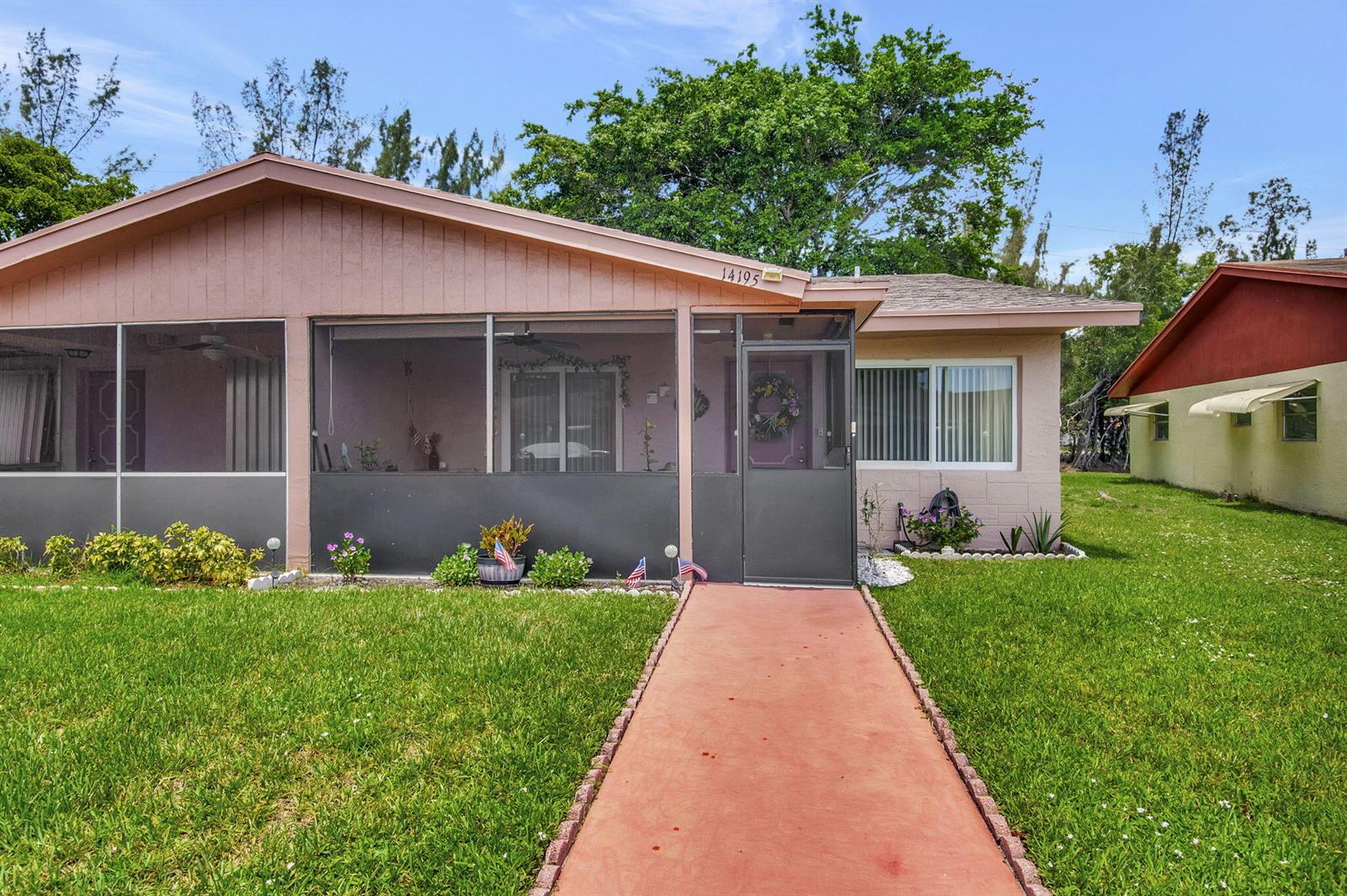 A single-story house with a screened-in porch, a red walkway, and a grassy front yard — 14195 Campanelli Drive, Delray Beach FL 33484, DELRAY BEACH, FL
