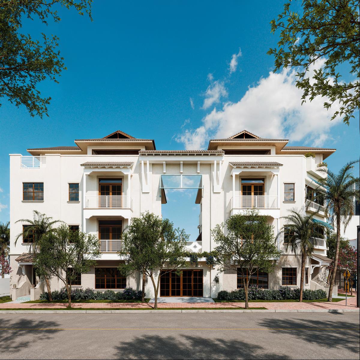 A low-angle exterior view of a symmetrical, white multi-story apartment building with a central breezeway — 102 SE 5th Avenue # 2, Delray Beach FL 33483, DELRAY BEACH, FL