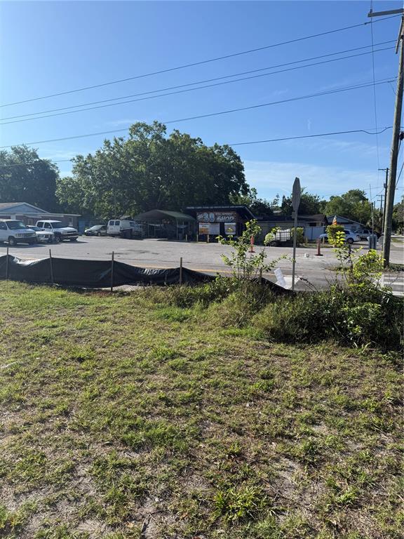 A view of a paved parking lot in front of a small commercial building — 4801 N 30TH STREET, TAMPA, FL