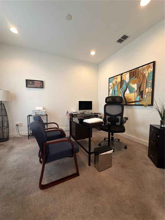 A home office features a desk, computer, two guest chairs, and abstract wall art — 4086 DINNER LAKE WAY, LAKE WALES, FL