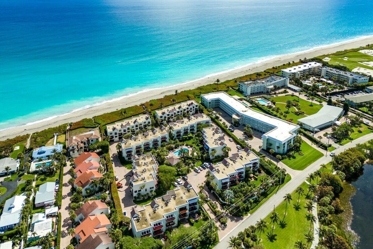 Aerial view of a beachfront resort complex with multiple buildings, pools, and landscaped grounds — 170 Celestial Way # 2, Juno Beach FL 33408, JUNO BEACH, FL