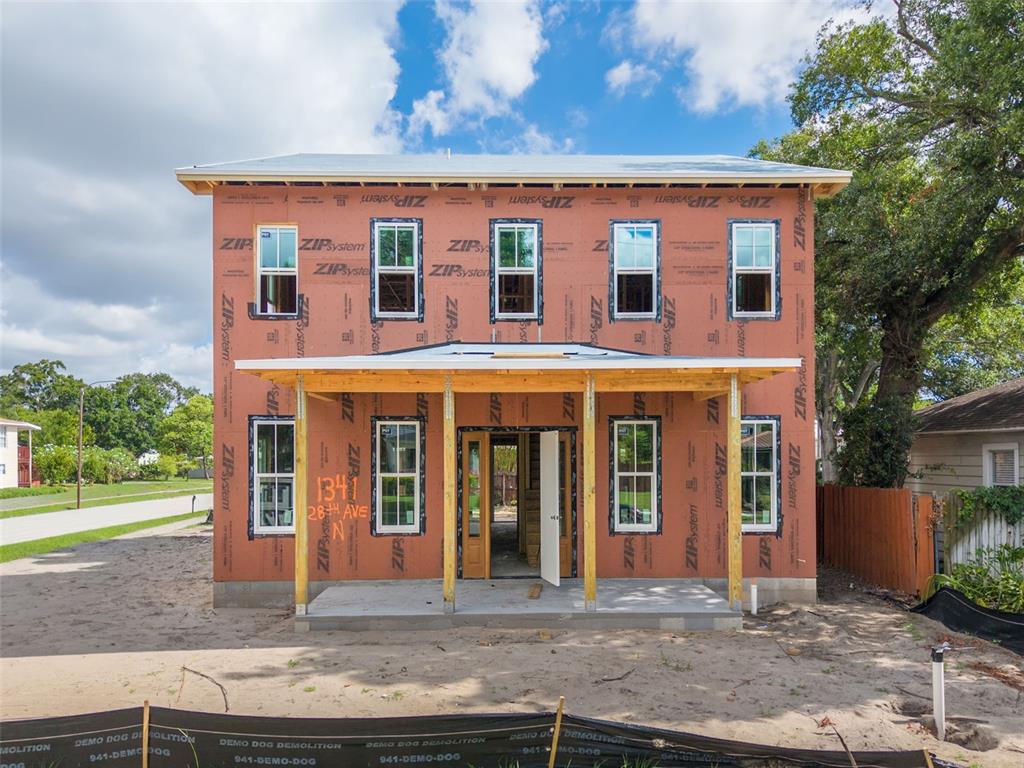 A two-story house under construction with orange ZIP System sheathing and a front porch — 1341 28TH AVENUE N, ST PETERSBURG, FL