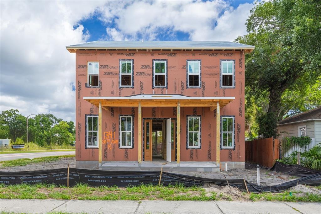 A two-story house under construction with orange ZIP System sheathing and a front porch — 1341 28TH AVENUE N, ST PETERSBURG, FL