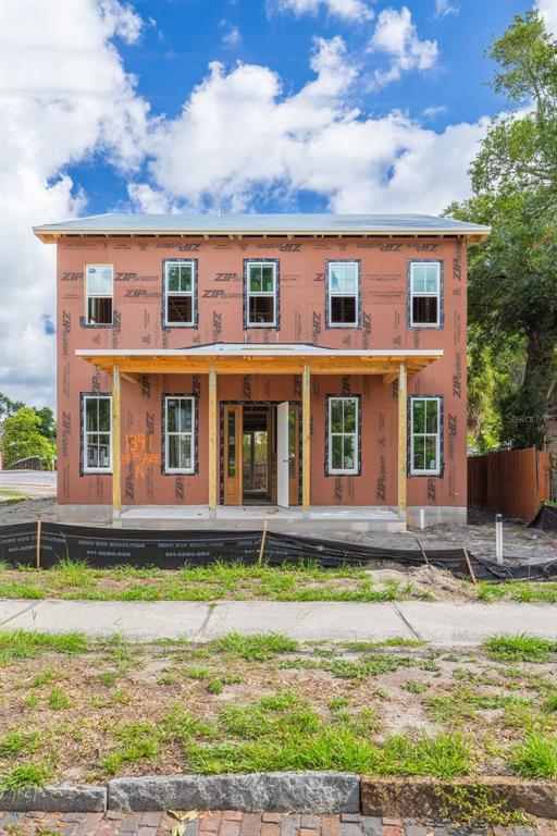 A two-story house under construction with exposed ZIP System sheathing and a front porch — 1341 28TH AVENUE N, ST PETERSBURG, FL