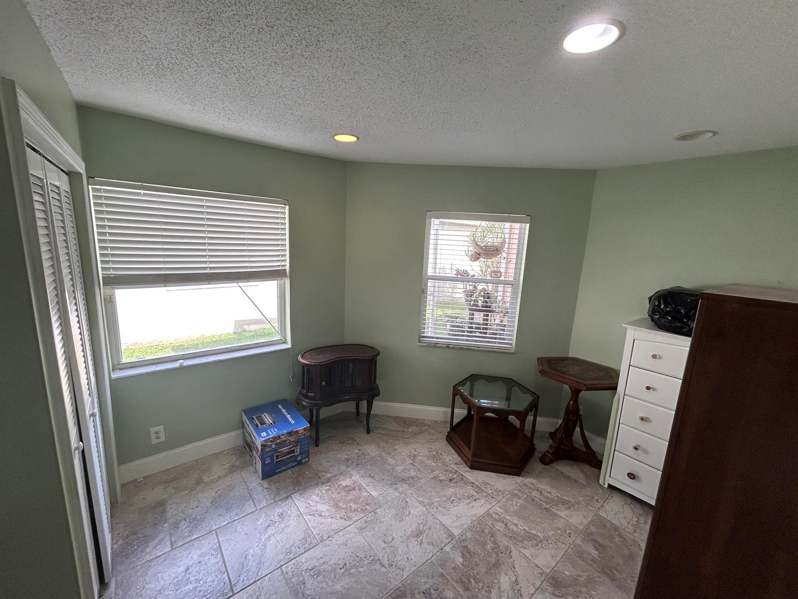 A single-story tan house with a two-car garage and a tiled roof — 6376 Breckenridge Circle, Lake Worth FL 33467, LAKE WORTH, FL
