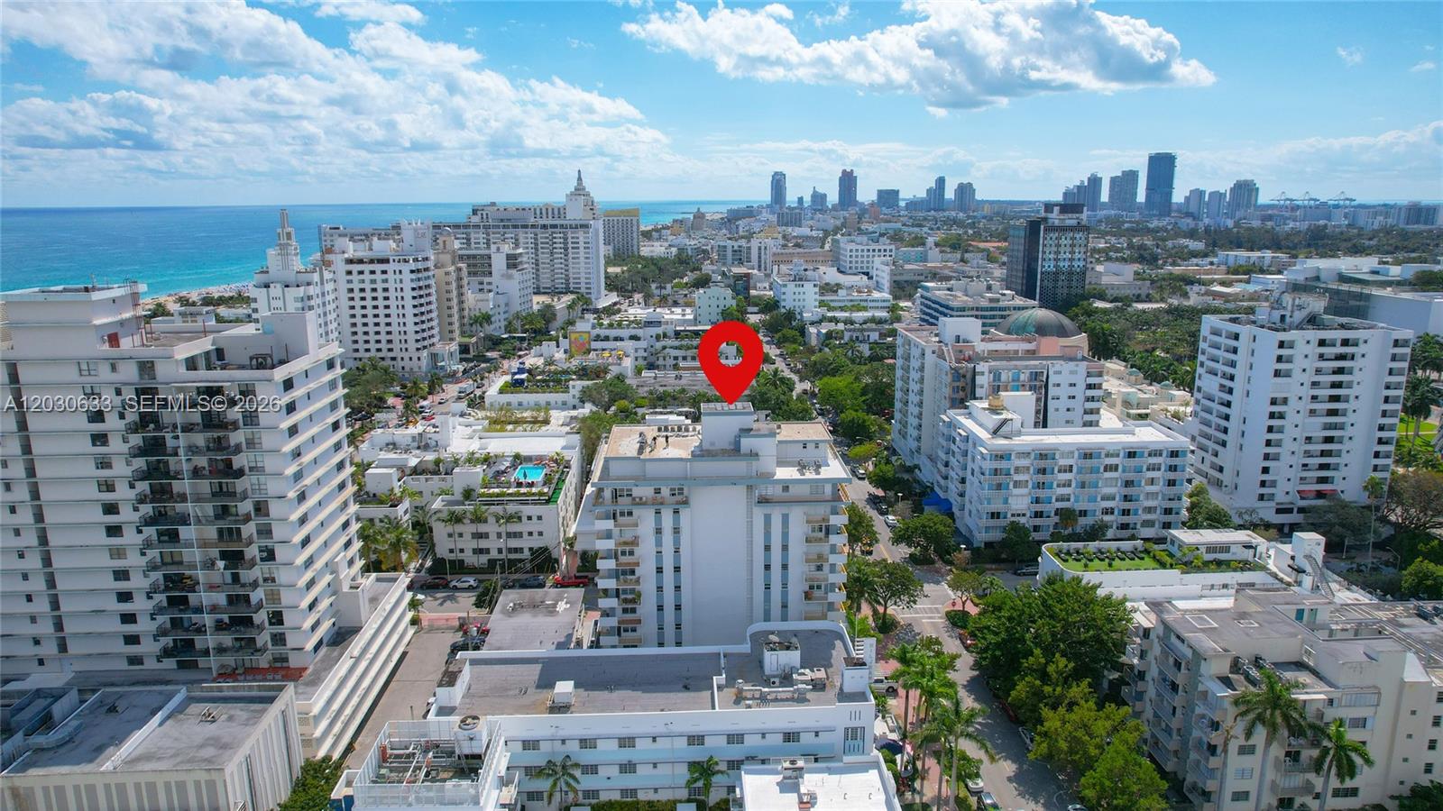 An aerial view shows a white high-rise building marked with a red location pin — 245 18th St # 605, Miami Beach FL 33139, MIAMI BEACH, FL