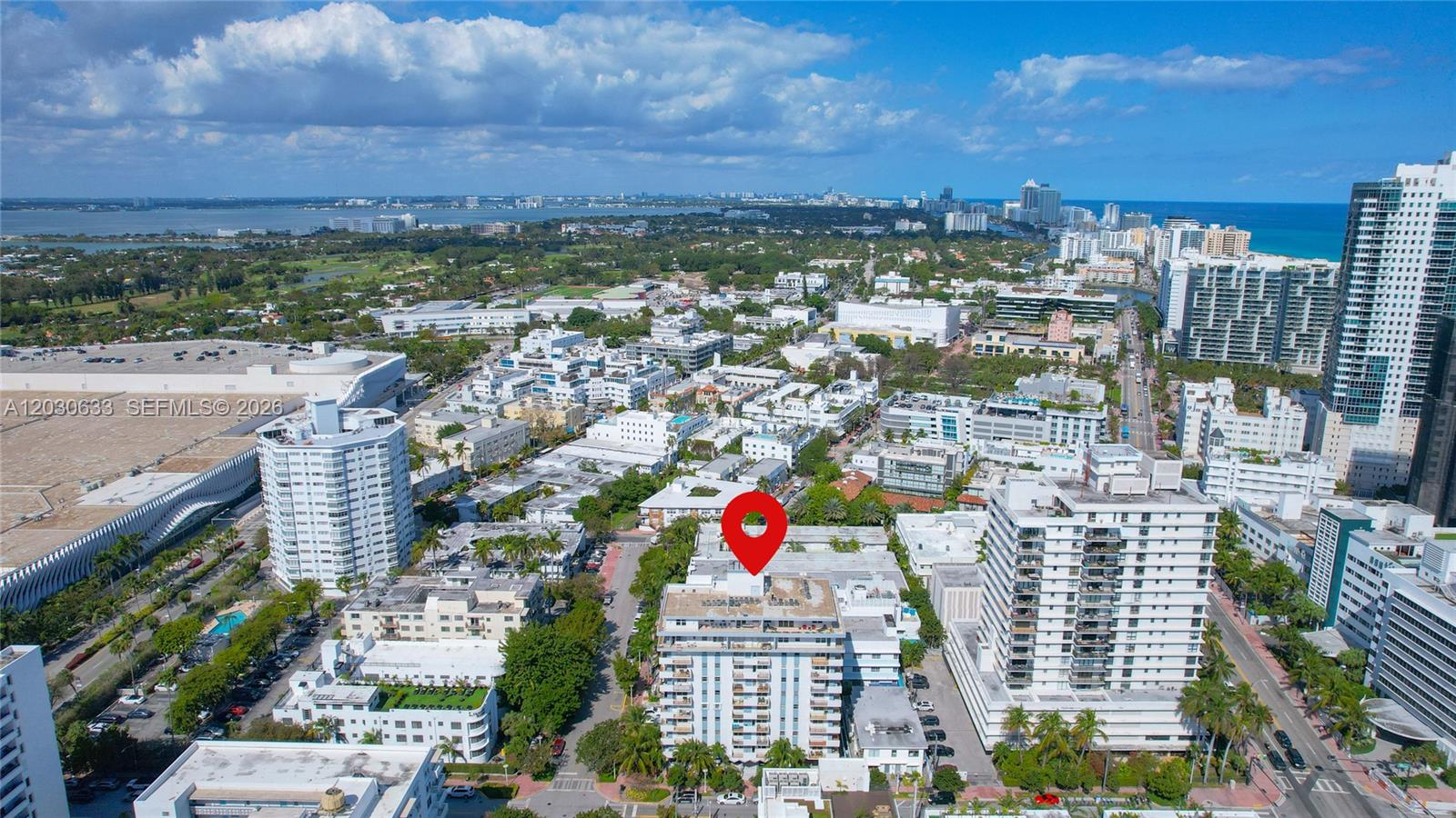 An aerial view shows a multi-story residential building marked with a red pin in Miami — 245 18th St # 605, Miami Beach FL 33139, MIAMI BEACH, FL