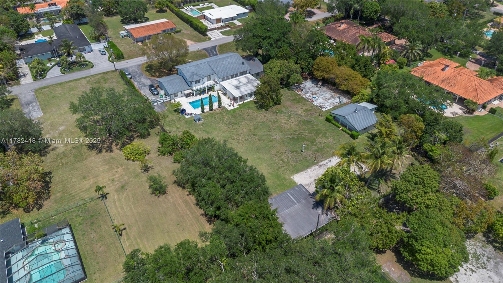 An aerial view shows a large residential property with a pool and multiple outbuildings — 8350 SW 98 th St, Miami FL 33156, MIAMI, FL