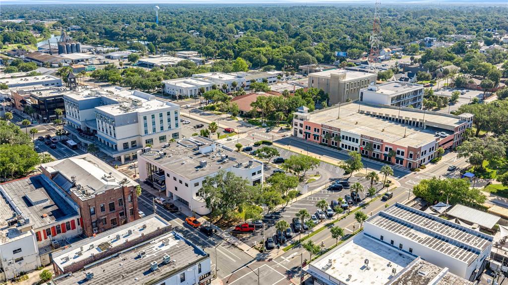 An aerial view shows a downtown city block with commercial buildings, parking lots, and trees — 35 SE 1ST AVENUE 2nd Floor, OCALA, FL