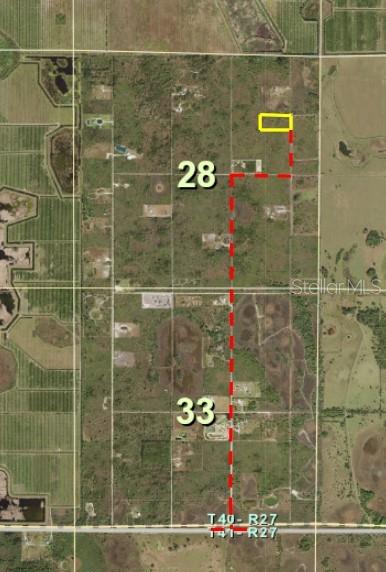 This is an aerial map showing a parcel of land outlined in yellow and red — 50760 BERMONT ROAD, PUNTA GORDA, FL