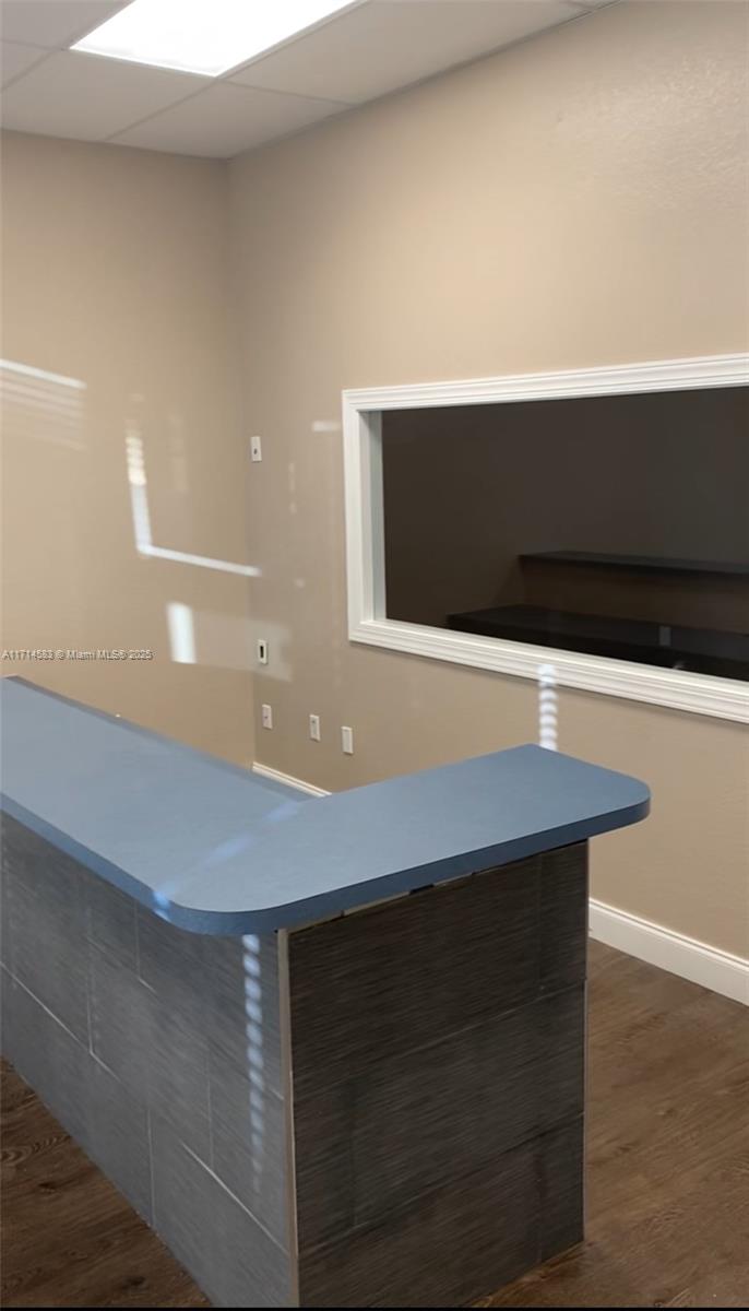An interior view shows a reception desk with a blue countertop and a pass-through window — 5360 S University Dr, Davie FL 33328, DAVIE, FL